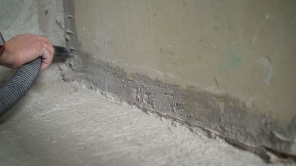  cleaning service. dust removal with vacuum cleaner. Worker removes dust with a vacuum cleaner