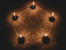 White Pentagram Symbol On Concrete Ground. Illuminated With Candles. Dark Background. Scary, Mystical Occultism 