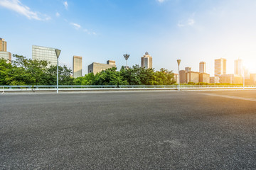 Wall Mural - empty urban road with modern building in the city.