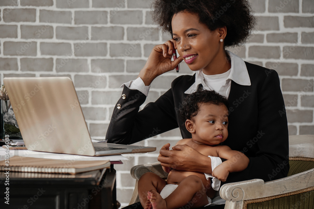 african american business woman with baby working at home - obrazy, fototapety, plakaty 