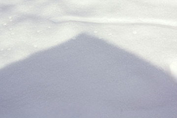 Wall Mural - shadow on the snow from the roof of the house