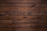 Fototapeta Tęcza - Planks of dark old wood texture background