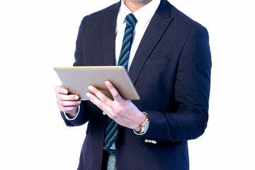 Tablet in the hands of a business man wearing a suit. Working to analyze marketing for online trading.on a white background.