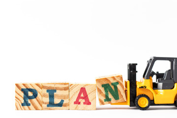 Wall Mural - Toy forklift hold wood letter block n to complete word plan on white background