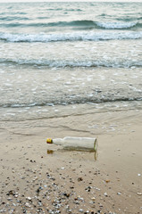 Empty bottle on the beach