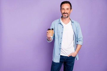 Poster - Portrait of charming positive man have weekends hold cup with hot beverage espresso feel content emotions wear good looking outfit isolated over violet color background