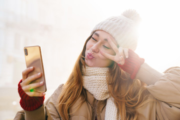 Poster - Close up of a cheerful pretty young girl wearing winter jacket