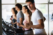 © NDABCREATIVITY - Picture of people running on treadmill in gym