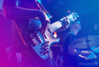 Close up of electric guitar during rock concert