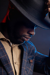 African american business man in black hat in studio