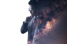 The Double Exposure Image Of The Businessman Thinking Overlay With Milky Way Galaxy Image. The Concept Of Imagination, Technology, Future And Inspiration.