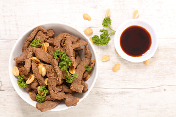 Wall Mural - fried beef, spice and nuts with noodles- asian dish