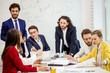 © alfa27 - young diverse caucasian people hold business meeting in office, everyone in formal wear, have conversation and discussion of business project and deadlines