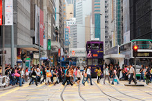 People Walking On Road In City