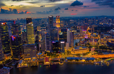 Fototapete - Aerial view of the Singapore landmark financial business district at sunset scene with skyscraper and beautiful sky. Singapore downtown