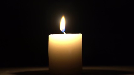 Sticker - The candle burns in the darkness.