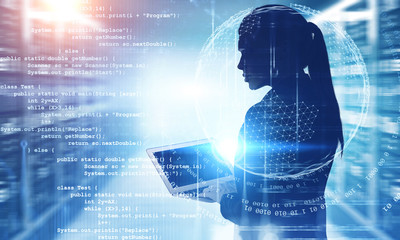 woman engineer with laptop coding in data center