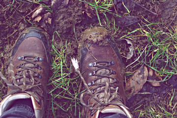 muddy walking shoes with brown color. Wanderlust.