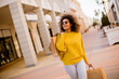 © BGStock72 - Young black woman with curly hair in shopping