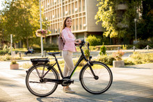 Young Woman With Modern City Electric E-bike Clean Sustainable Urban Transportation