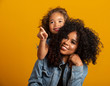 © Brastock Images - happy mother's day! Adorable sweet young afro-american mother with cute little daugh.