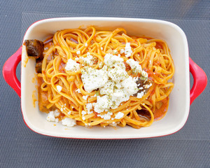 linguine alla ricotta, italian gourmet pasta plate top view close up on black table