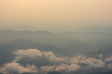 Wall Mural - Sunrise among mountains and fog