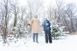 © satura_ - Parenting, fun and season concept - Happy mother and son having fun and playing with snow in winter forest