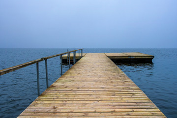  Wooden pier  going into the water.