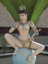 Vertical Shot Of A Hindu Statue At Daytime