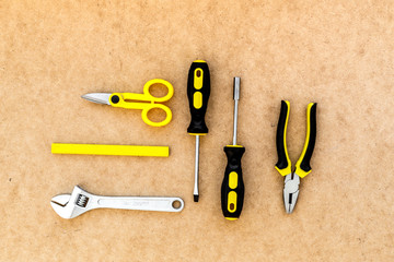 Wall Mural - Tools for repairing top view on pasteboard background