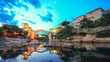 © pilat666 - Majestic evening view of Mostar with the Mostar Bridge, houses and minarets, at evening