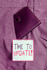 Wall Mural - Writing note showing Time To Update. Business concept for this is right moment to make something more modern new Small wallet inside trouser front pocket near notation paper