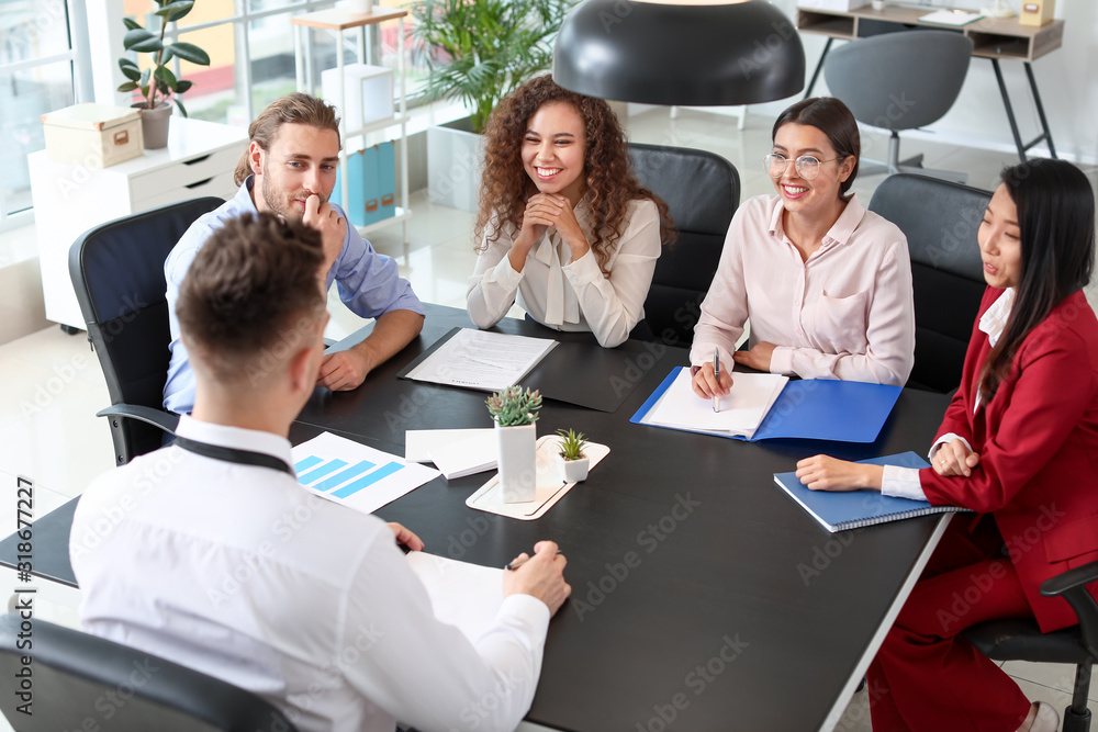 Human resources commission interviewing man in office