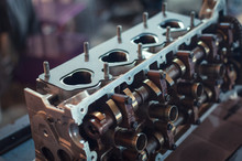 Engine Cylinder Head Lying On A Table In A Car Service