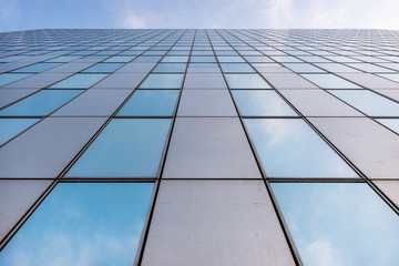 Wall Mural - glass facades of modern office buildings and reflection of blue sky