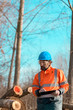 © Bits and Splits - Forestry technician using digital tablet computer in forest