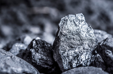 Coal mining industry. Natural black coals for background. Coal in the miner  hands. Volcanic rock.