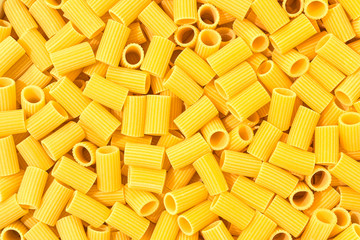 Italian Macaroni Pasta half sleeves striped raw food background or texture