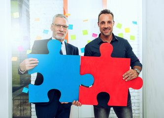 Wall Mural - Partnership of business people. Concept of integration and startup with colored puzzle pieces