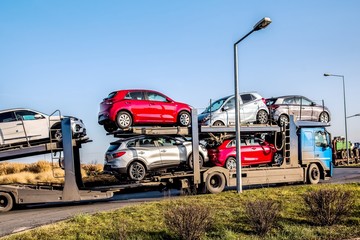  Car carrier on the highway. Freight transport, logistics cargo delivery