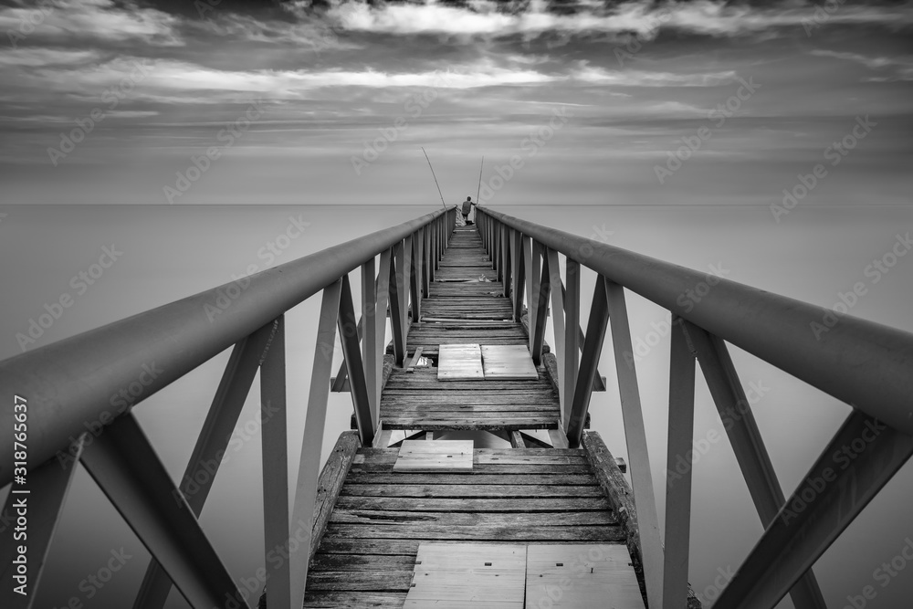 Mid Distance Of Person Standing On Broken Pier Over Sea - obrazy, fototapety, plakaty 