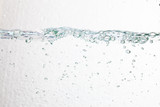Fototapeta Łazienka - Closeup bubbles underwater on white background.