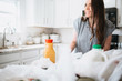 © MeganBetteridge - Lifestyle of women unloading her groceries at home in a white kitchen