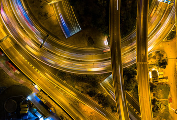 Canvas Print - Aerial view of city at night with Light Track