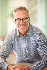 Mature handome fit man sitting outside stock photo