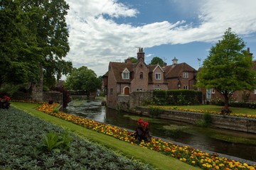 Canvas Print - Road surrounded by buildings and gardens after the rain in Canterbury in the UK