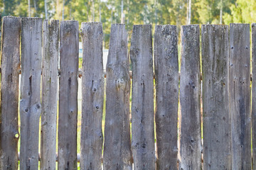 Wall Mural - Old wooden fence in summer village in Russia