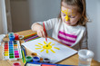 © Angelina - little girl paints the yellow sun
