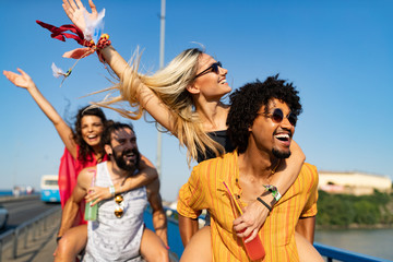 group of friends having fun time at music festival